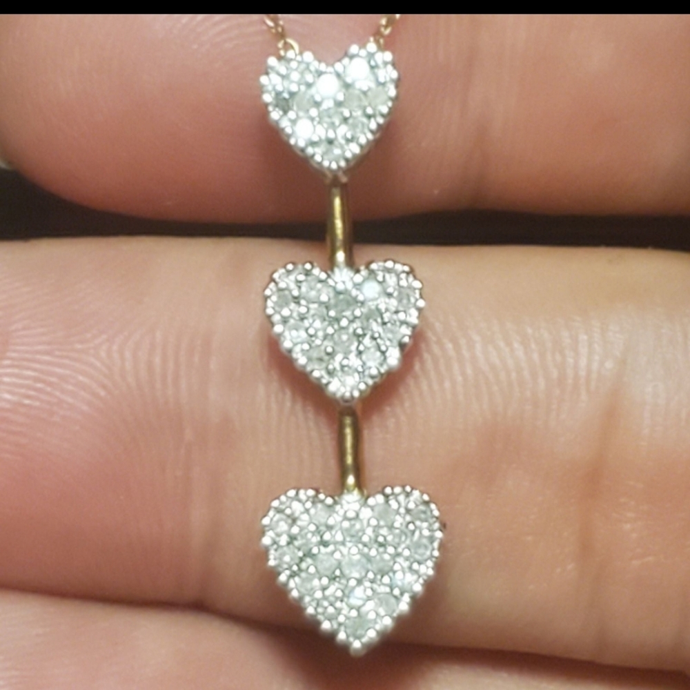 10k Yellow gold french diamond hearts necklace..